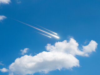 Wall Mural - meteor shower streaking across a blue sky. shooting stars in daylight above the clouds.