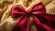 © Zie - Elegant Red Bow on Golden Fabric