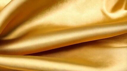 Poster - Elegant gold satin fabric with soft flowing folds creating a luxurious shimmering textile background for design