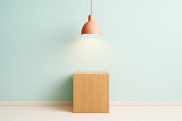 Poster - Minimalist wooden cube pedestal under hanging lamp on pastel blue background with soft light and abstract clean graphic composition.