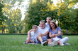 © Loginova - Happy Family Enjoying Quality Time Together Outdoors in a Park..