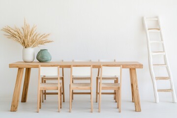 Poster - Contemporary dining room concept. Stylish wooden dining table with chairs, decorated with a vase and decorative ladder against a neutral wall.