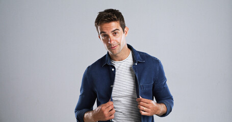 Poster - Man, portrait and jean shirt for fashion with casual tshirt, trendy style and confident on white background. Denim apparel, stripes and male model with stylish outfit, mockup space and cool clothes