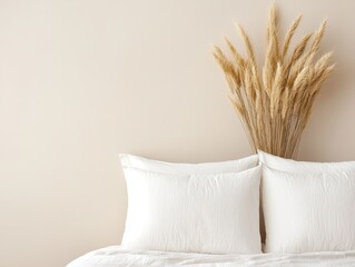 Poster - Warm natural bedroom concept. Cozy bedroom setup with white pillows and dried grass decor against a neutral wall.
