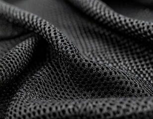 close-up of black mesh fabric with intricate texture and pattern
