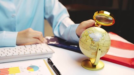 Poster - Businessperson Analyzing Data With Globe and Laptop in Modern Office Setting