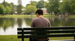 © artpixel - Person sitting on park bench, tranquil scene