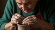 © naevermillion - Elderly Woman Skillfully Shaping Clay on a Potter's Wheel A Master Craftsperson at Work