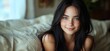 © Vergiliy - Portrait of a young woman with long black hair and captivating green eyes in a cozy setting