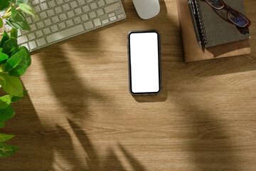 Poster - Minimalist office setup with blank screen smartphone, planner, and stylish  in natural lighting.