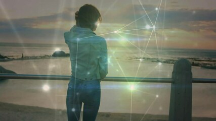 Poster - Woman lifting smartphone making call and activating tech network overlay while scanning horizon