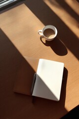 Poster - Sunlit workspace showcasing simplicity with notebook and cup creating a harmonious atmosphere for productivity