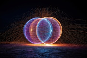 Poster - a mesmerizing light painting of intersecting spheres with sparks in the night, showcasing vibrant co