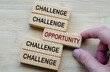 © Maurice Yom - Challenges and Opportunities Coexist, a reminder that every challenge carries potential opportunities, shown through opposing wooden block messages