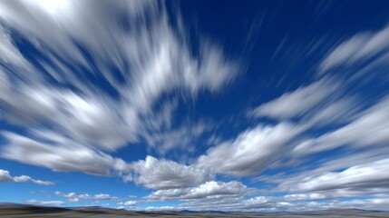 Poster - Dynamic cloud movement captured in blurred long exposure over a clear blue sky