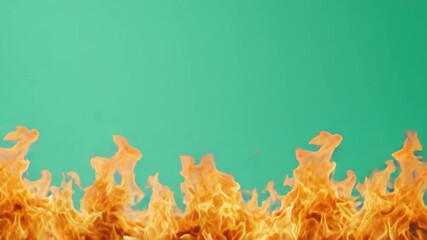 Poster - Vibrant Flames Brightly Burning Against a Soft Green Background for Creative Visuals and Design Concepts