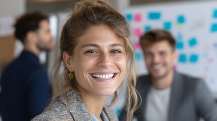 Poster - Professional smiling young woman in a modern office environment showcasing a positive outlook and teamwork in progress