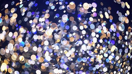 Poster - Golden, silver and blue confetti are falling against a dark background, creating a festive and celebratory atmosphere suitable for various occasions