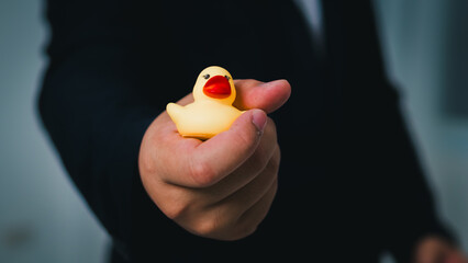 Aufkleber - Business hand holding rubber duck creative office environment fun and quirky perspective