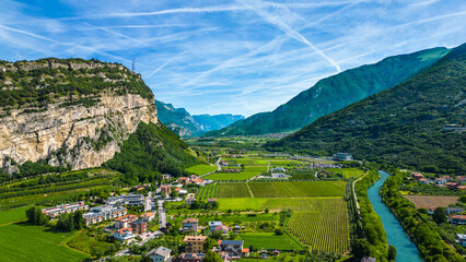 drone view of northern lake garda near torbole, linfano. surrounded by mountains, clear turquoise wa