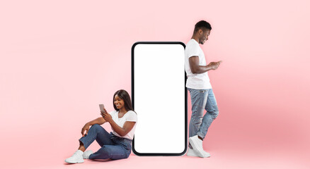 Poster - Modern Virtual Communication. Creative collage of young black couple leaning on big cell phone screen with blank white screen for mock up template, guy and lady chatting, sending and reading sms