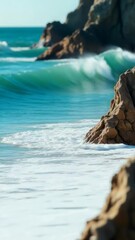 Fototapete - A wave crashes onto the sand as the tide comes in