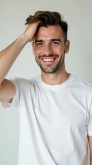 Poster - A man holds his hair back, revealing a bright smile