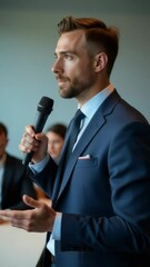 Poster - A businessman speaks confidently into a microphone, ideal for presentations, meetings, and corporate communications