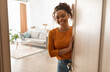 © Prostock-studio - Joyful African American Female Opening Door And Smiling To Camera Standing At Home. Friendly Lady Meeting You In Doors Of Her House. Real Estate Property Ownership Concept