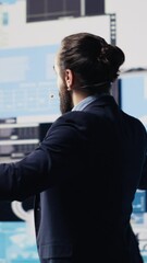 Poster - Vertical Video Public speaker CEO hosting business presentation to share a vision, discuss about new growth strategy and ideas for global development. Using a hands free microphone for attendees