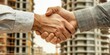 © Irfanan - Handshake Between Developers Finalizes Deal with Construction Site Background and Commitment