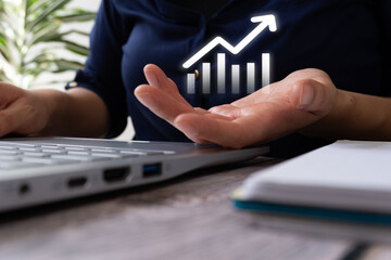 Poster - A person holding their hand out, with an upward-trending graph floating above it and showing growth in business or financial performance
