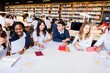 © Rawpixel.com - Diverse group of students studying in a library. Students collaborate, study, and learn together. Library with books and computers. Group study session. Diverse high school students at a library.