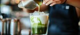 Iced matcha latte being prepared