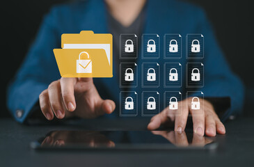 Fototapete - Secure data management concept with businessman using tablet. Locked digital folder and documents represent cybersecurity, safe information storage and file protection, privacy policy