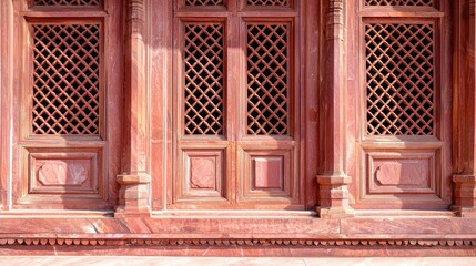 Poster - Ornate Red Stone Architecture with Intricate Carved Windows