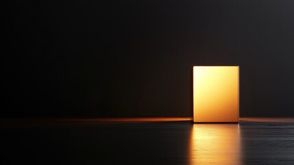 Poster - A glowing cube emits warm light in a dark room. The surface reflects the light, creating a serene atmosphere. Minimalist design emphasizes simplicity.