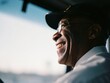 © Cavan Images - Smiling black bus driver enjoying the journey
