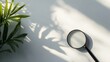 © Juan - Magnifying glass on wall shadows editorial detective minimal concept search inspection clarity object image