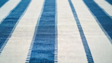 Poster - striped fabric pattern: a close-up view of a fabric displaying blue and white stripes creates a visu