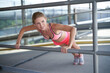© Westend61 - Determined sportswoman doing push-ups on railing at bridge