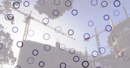 Poster - Image of falling circles over construction site