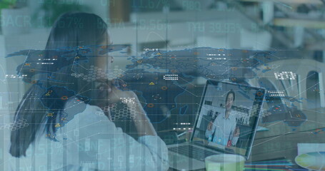 Poster - Image of graphs and world map over woman having image call on laptop