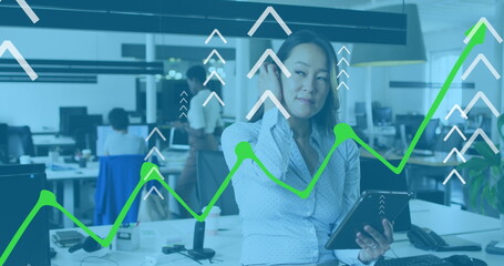 Poster - Image of arrows and graphs over asian woman in office