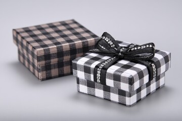 Poster - Gift boxes wrapped in checkered patterns with ribbon detail on a gray background