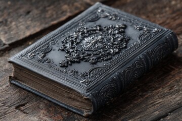Poster - Vintage ornate book resting on rustic wooden surface under soft light showcasing intricate cover design