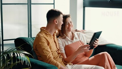 Poster - Couple, laughing or pointing to tablet in home for online shopping, app choice or purchase decision. Relax, people and bonding together with digital tech on sofa for reading information and research