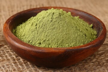 Poster - Green powder displayed in a rustic bowl showcasing its texture and vibrant color in a natural setting
