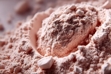 Poster - Pink powder rests in a pile on a surface, reflecting light in a natural setting during daylight hours