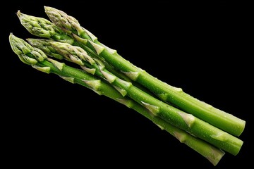 Poster - Fresh green asparagus stalks on a black background showcasing their natural beauty and vibrant colors